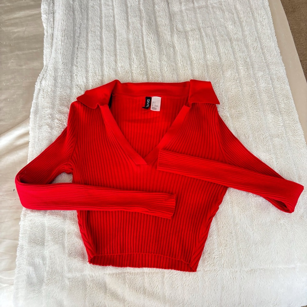 I’m selling a red long sleeve shirt that has never been worn before